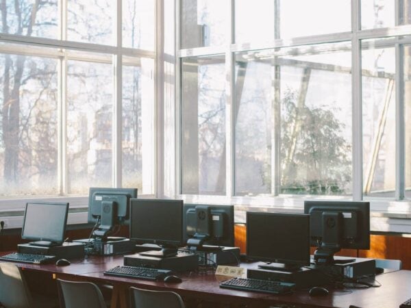 Photo Of Computers On Wooden Table