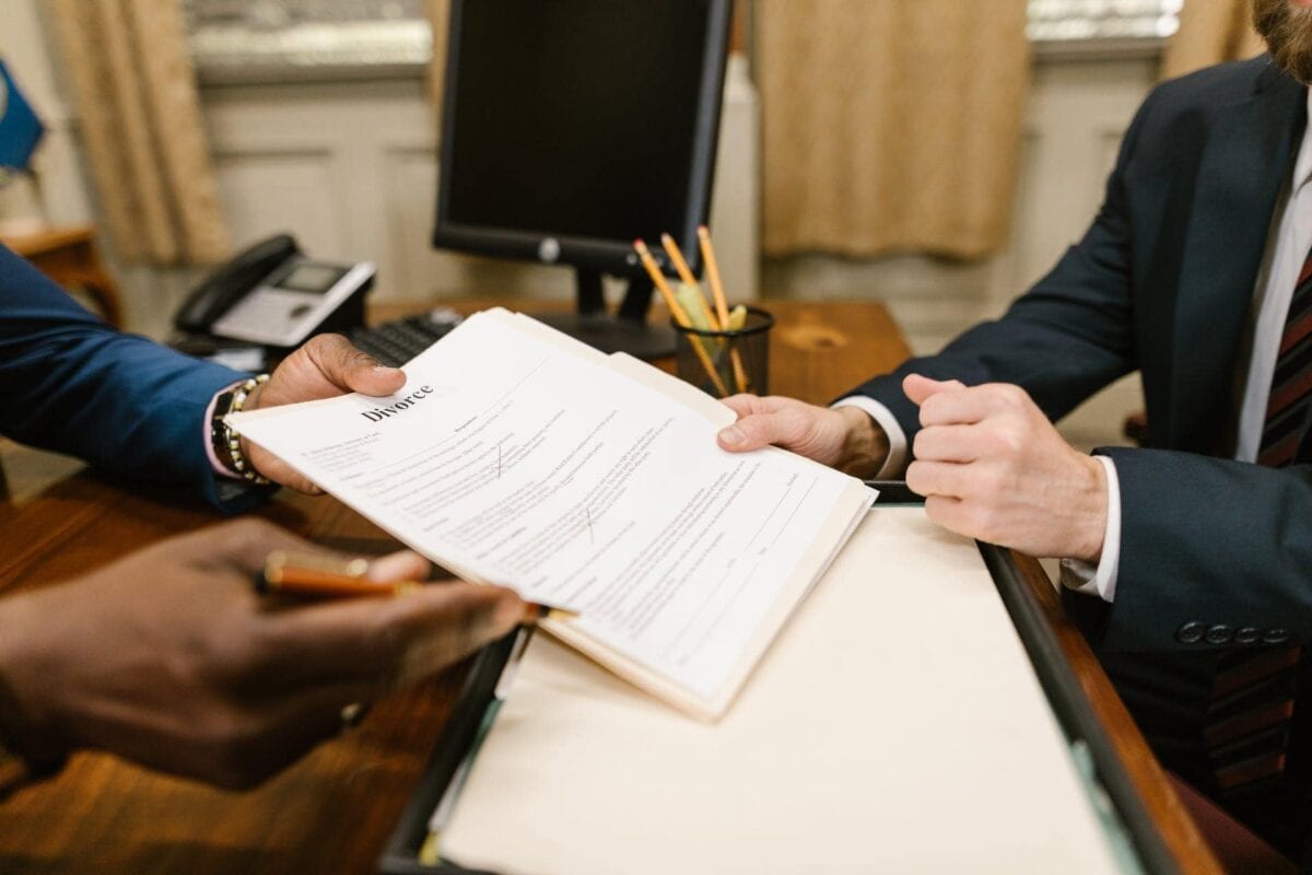 Close-Up Shot of a Person Holding Papers